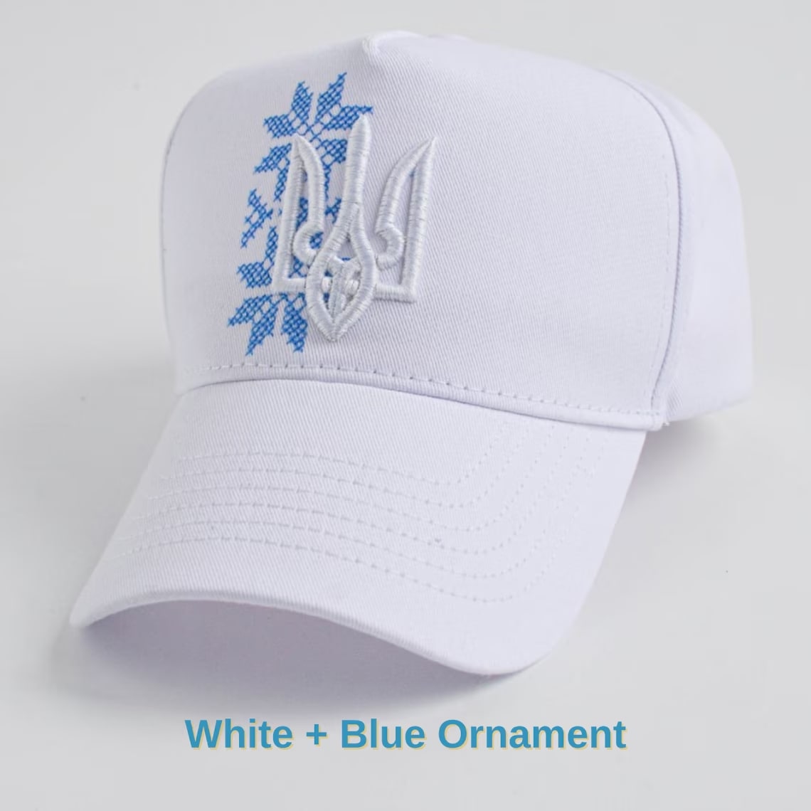 White+Beige Ornament trucker with embroidered trident